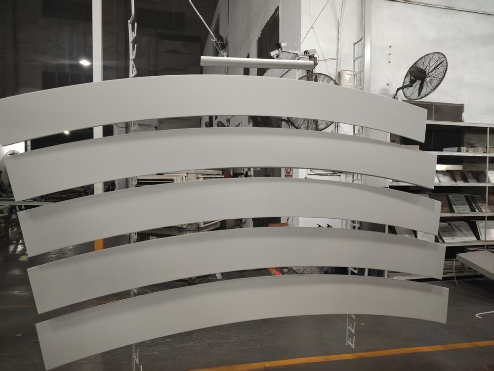 Factory view of aluminum panels during powder coating process